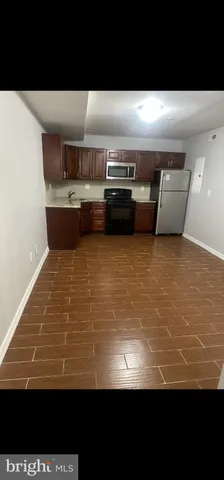 a view of kitchen with stainless steel appliances