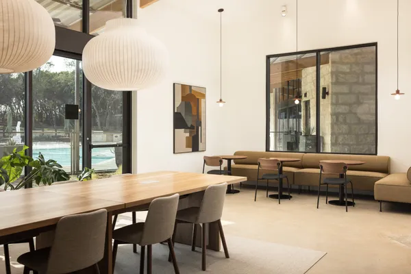 a dining room with furniture and wooden floor