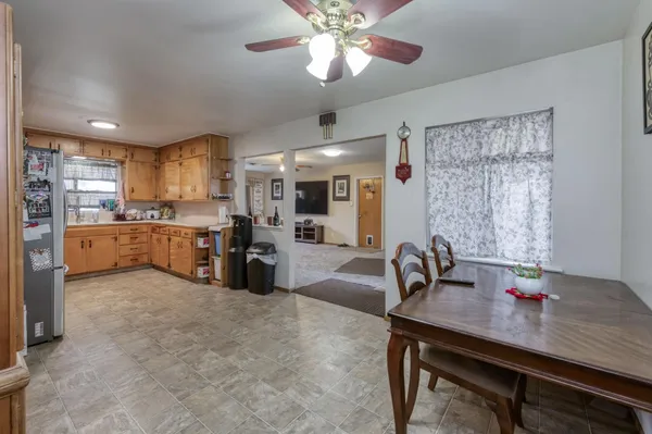 a kitchen with granite countertop a sink cabinets and stainless steel appliances