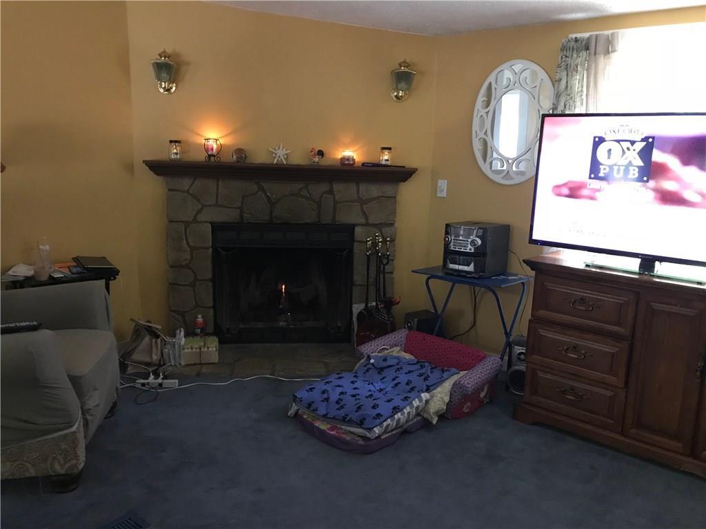 32 Bay Woods Road Bristol, ME 04539 - Photo 6 of 14 Living room with wood burning fireplace.