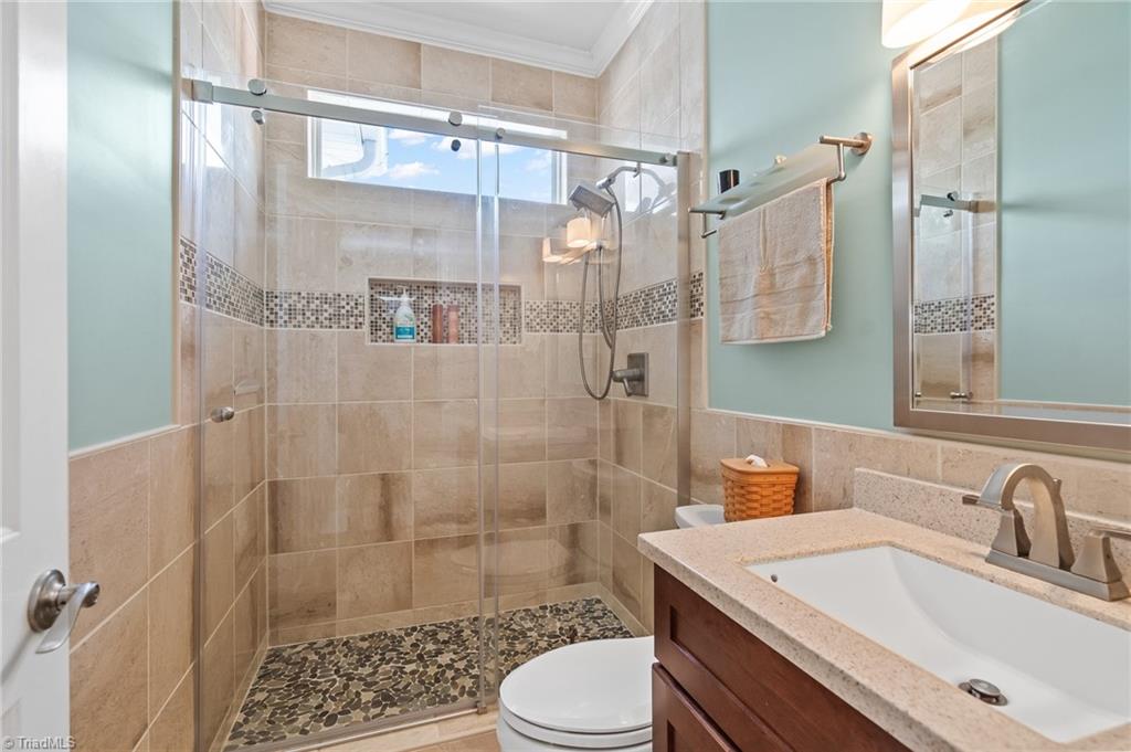 133 Lake View Road Prospect Hill, NC 27314 - Photo 19 of 50 Full guest bathroom with updated walk in shower