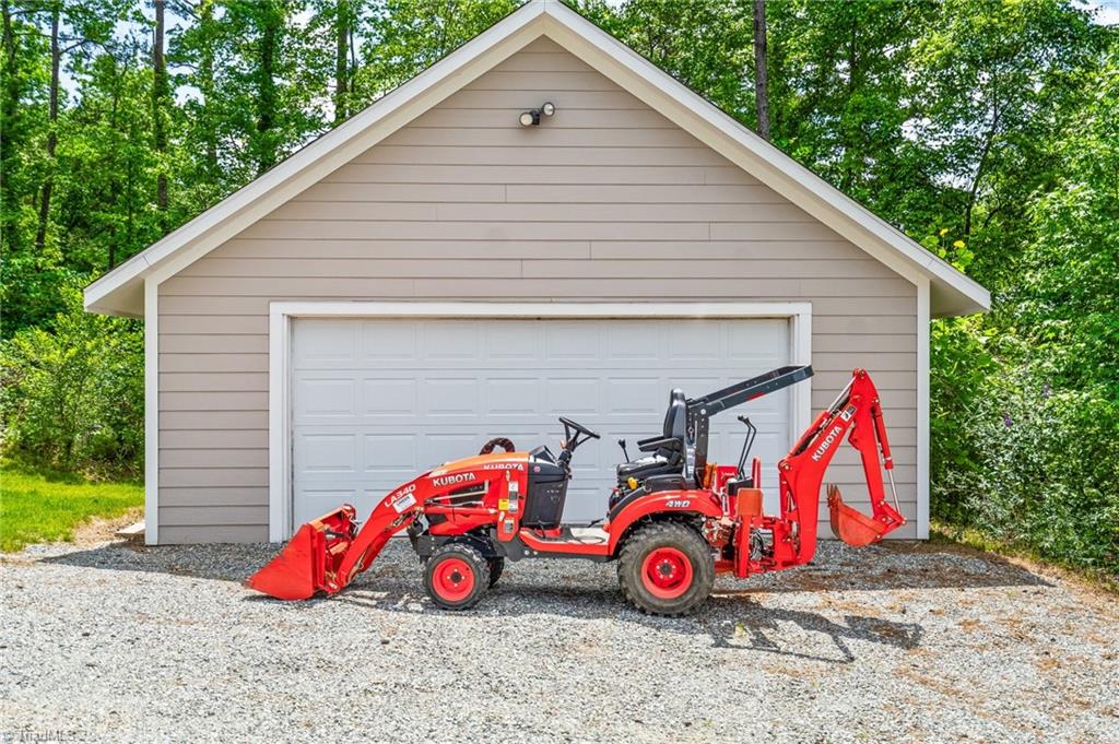 133 Lake View Road Prospect Hill, NC 27314 - Photo 39 of 50 Detached 24x24 garage with kubota tractor remains