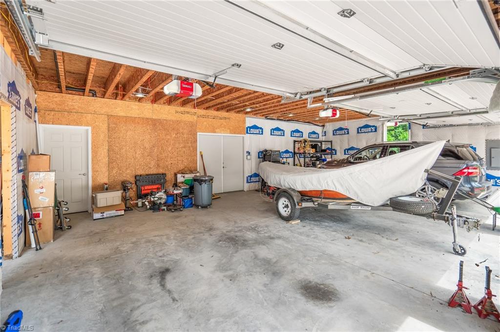133 Lake View Road Prospect Hill, NC 27314 - Photo 43 of 50 Inside view of 3 car garage with workshop in rear