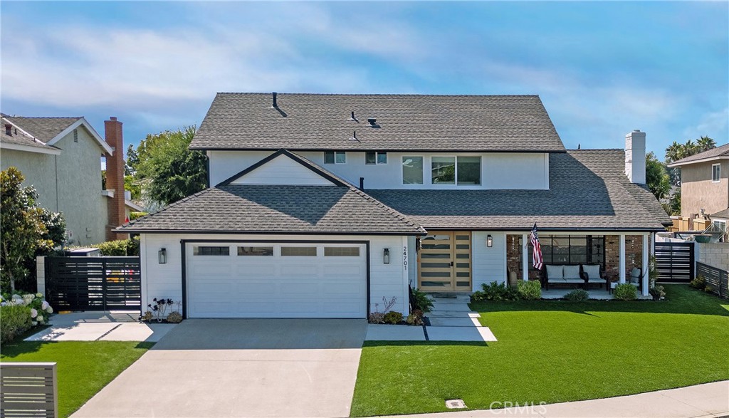 24701 Nympha Drive Mission Viejo, CA 92691 - Photo 1 of 75 a front view of a house with a yard table and chairs