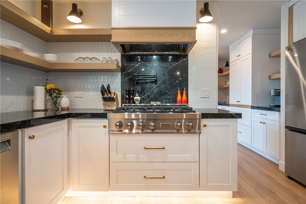 24701 Nympha Drive Mission Viejo, CA 92691 - Photo 15 of 75 a kitchen with stainless steel appliances wooden cabinets and a counter top space