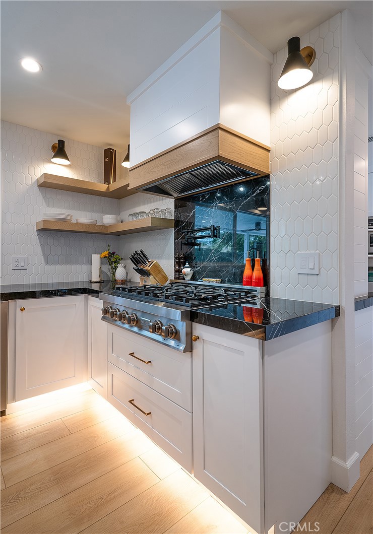 24701 Nympha Drive Mission Viejo, CA 92691 - Photo 16 of 75 a kitchen with stainless steel appliances granite countertop a sink and cabinets
