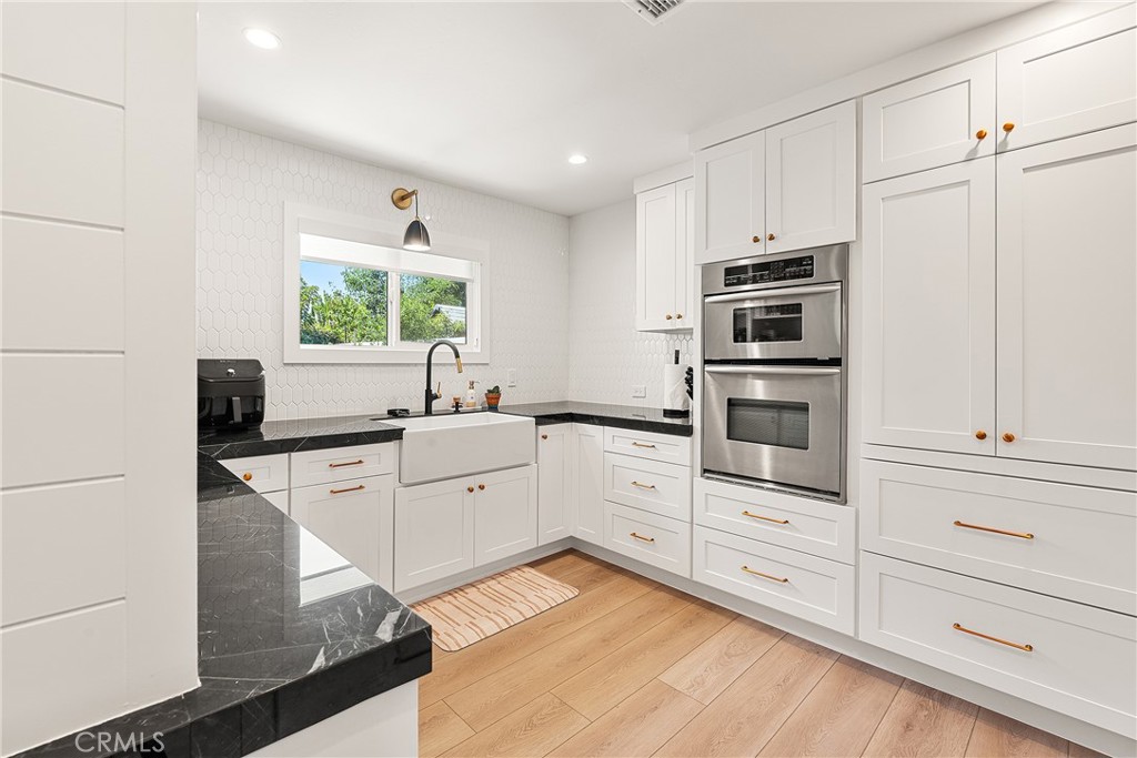 24701 Nympha Drive Mission Viejo, CA 92691 - Photo 20 of 75 a kitchen with cabinets appliances and a window