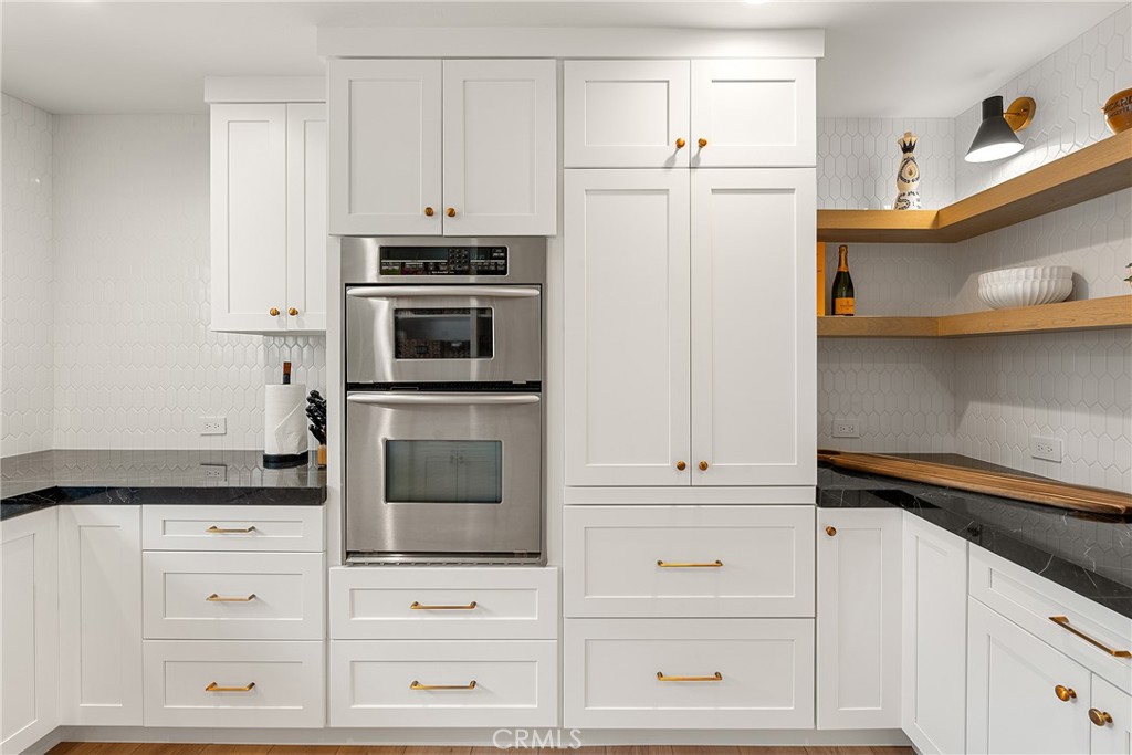 24701 Nympha Drive Mission Viejo, CA 92691 - Photo 21 of 75 a kitchen with white cabinets and oven