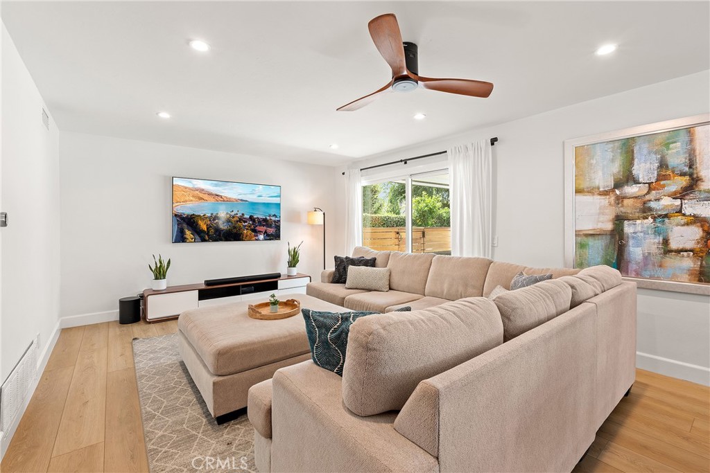 24701 Nympha Drive Mission Viejo, CA 92691 - Photo 29 of 75 a living room with furniture and a flat screen tv