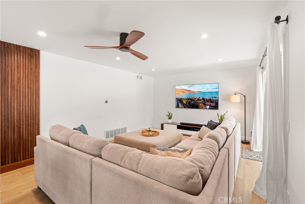 24701 Nympha Drive Mission Viejo, CA 92691 - Photo 30 of 75 a living room with furniture and a ceiling fan