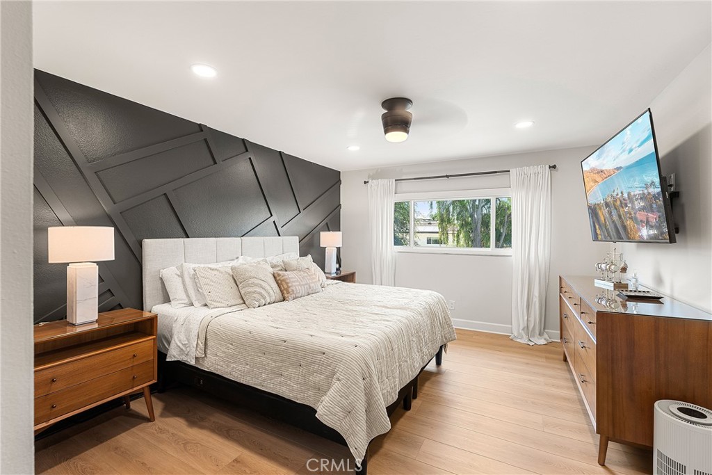 24701 Nympha Drive Mission Viejo, CA 92691 - Photo 41 of 75 a bedroom with a bed and a flat screen tv