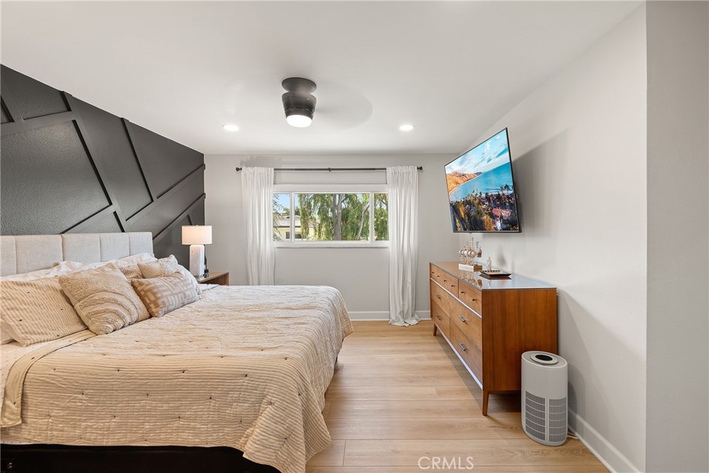 24701 Nympha Drive Mission Viejo, CA 92691 - Photo 42 of 75 a bedroom with a bed and a flat tv screen on dresser
