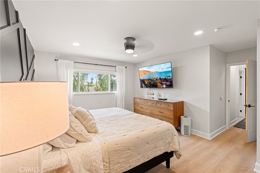 24701 Nympha Drive Mission Viejo, CA 92691 - Photo 43 of 75 a bedroom with a bed and a flat screen tv