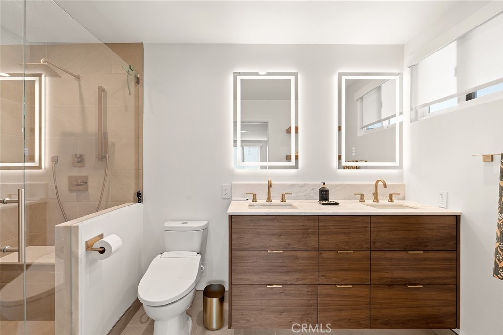 24701 Nympha Drive Mission Viejo, CA 92691 - Photo 44 of 75 a bathroom with a toilet sink and mirror