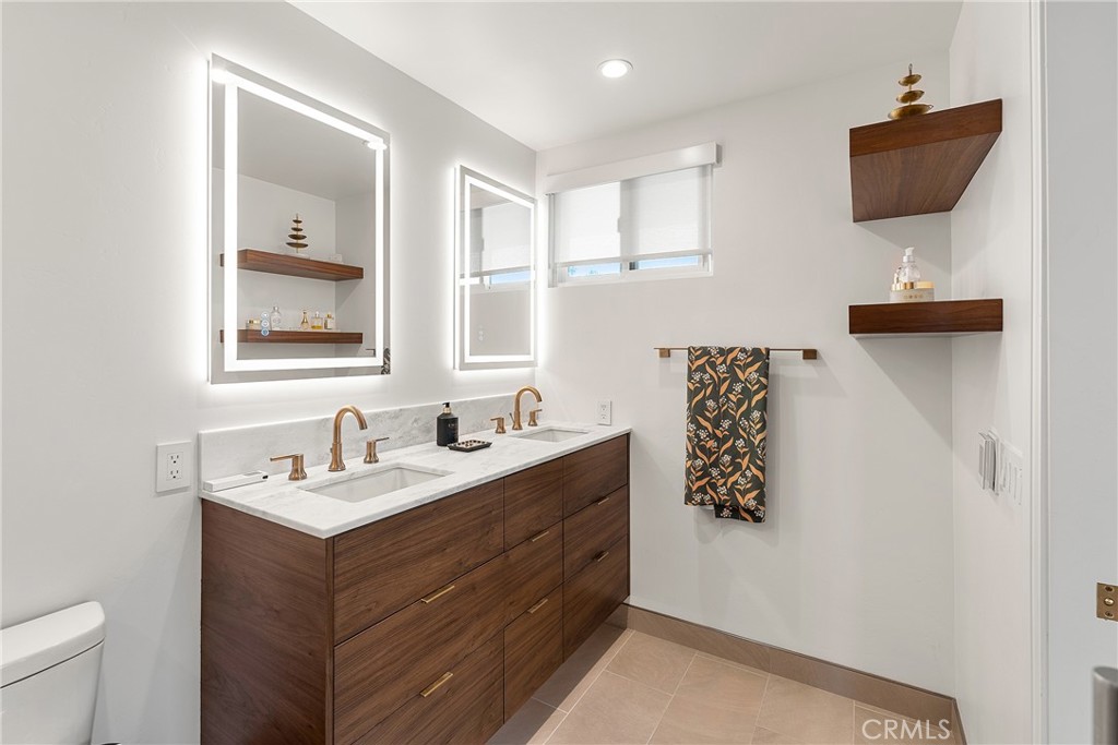24701 Nympha Drive Mission Viejo, CA 92691 - Photo 45 of 75 a bathroom with a sink mirror and vanity