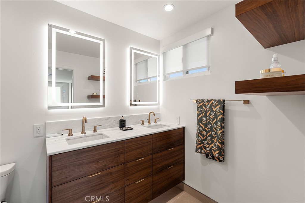 24701 Nympha Drive Mission Viejo, CA 92691 - Photo 50 of 75 a bathroom with a sink and a mirror