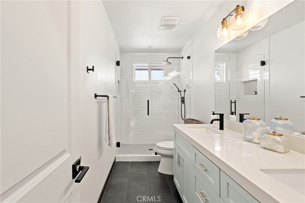 24701 Nympha Drive Mission Viejo, CA 92691 - Photo 53 of 75 a bathroom with a double vanity sink mirror and toilet