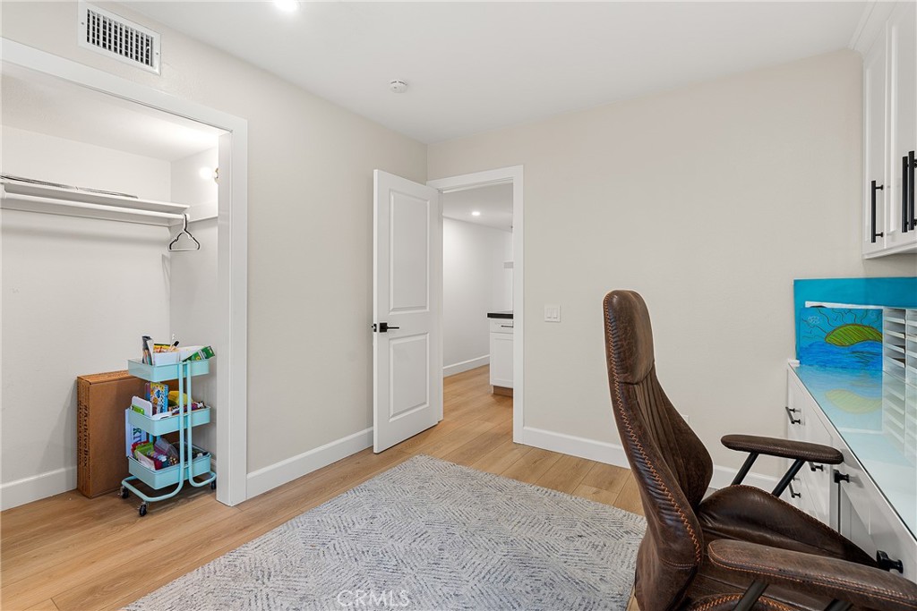 24701 Nympha Drive Mission Viejo, CA 92691 - Photo 67 of 75 a view of a workspace with furniture and wooden floor