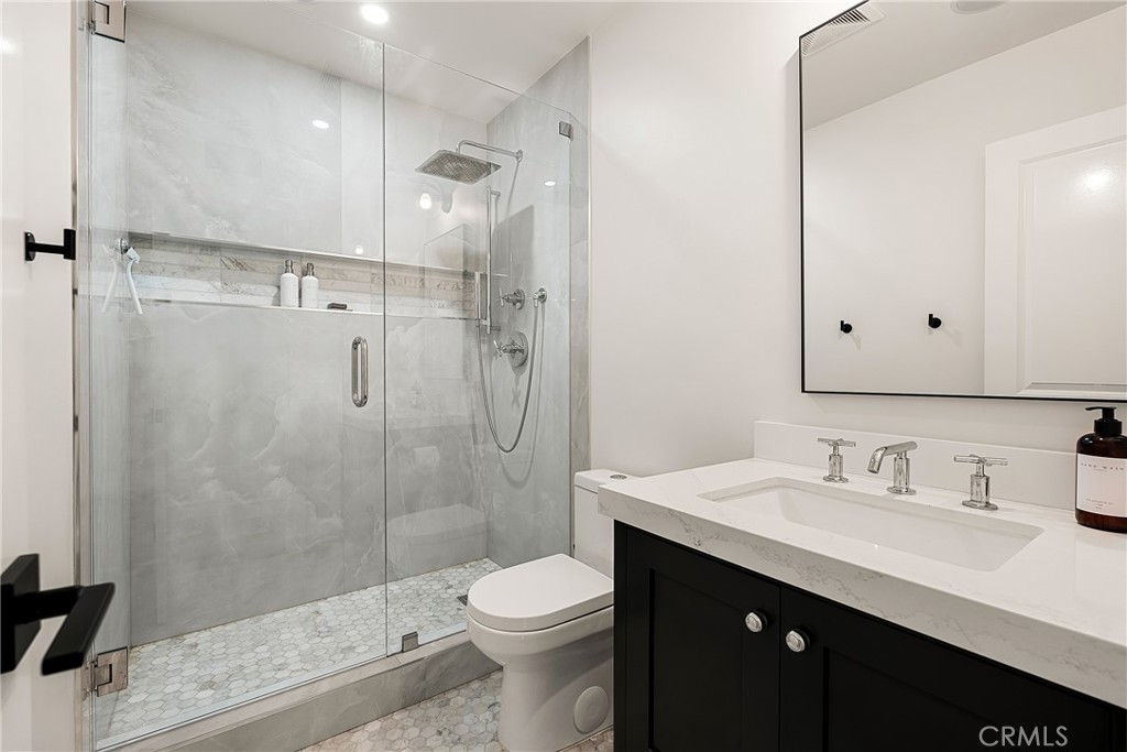 24701 Nympha Drive Mission Viejo, CA 92691 - Photo 68 of 75 a bathroom with a sink a toilet and shower