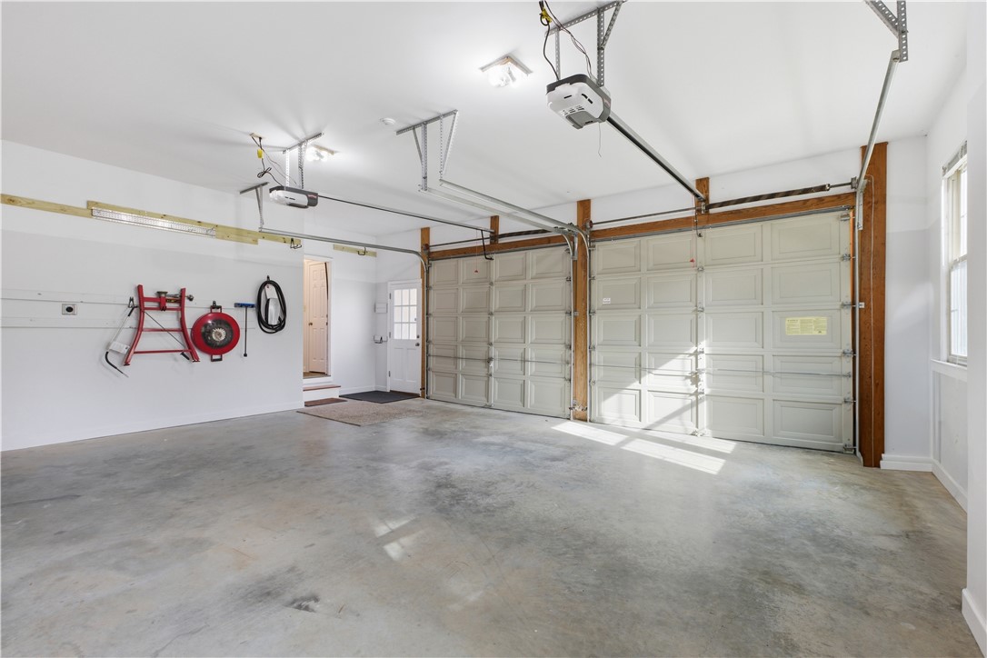 501 Capri Point Lavonia, GA 30553 - Photo 49 of 50 This spacious garage features multiple bays, providing ample parking and storage for your vehicles.