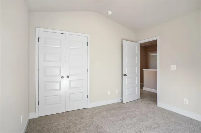 an empty room with closet area
