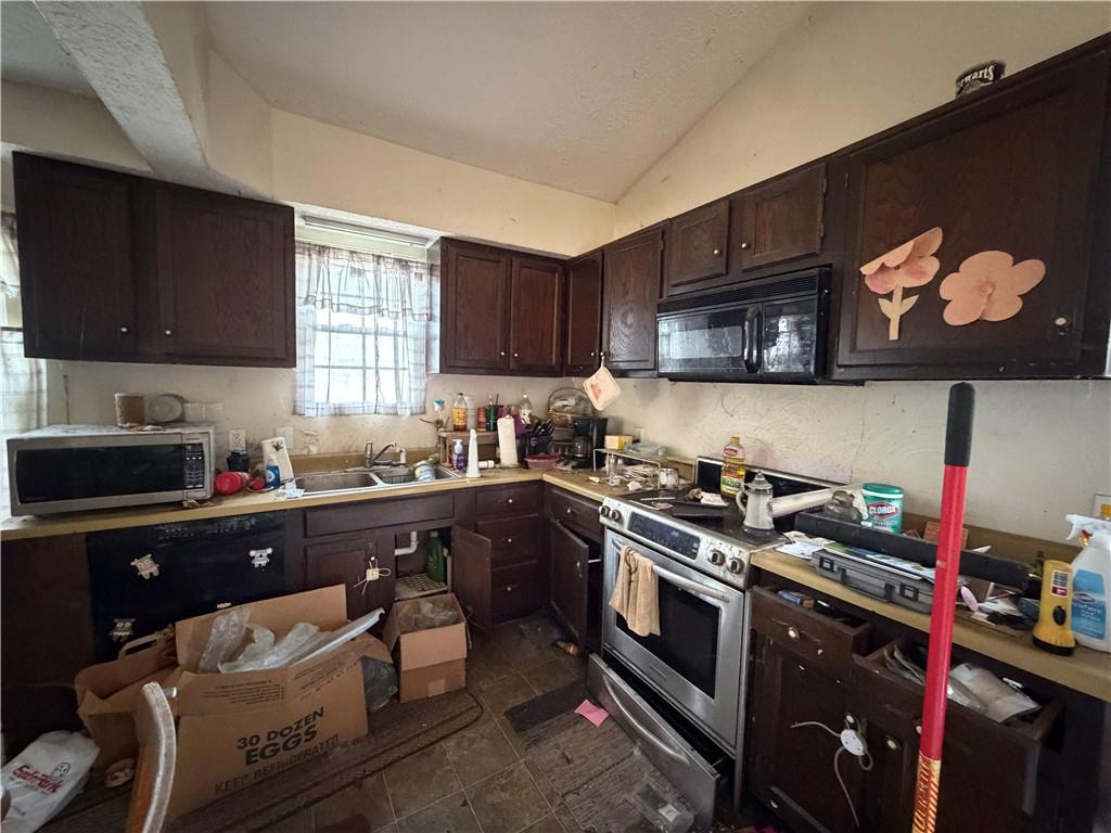 538 Branchton Road Slippery Rock, PA 16057 - Photo 4 of 15 a kitchen with a sink a stove and cabinets