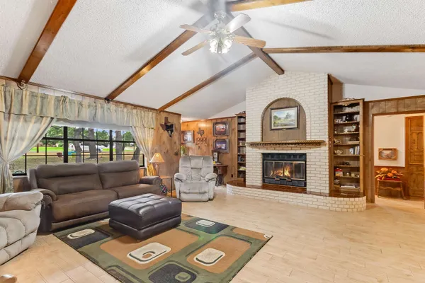 a living room with furniture and a fireplace