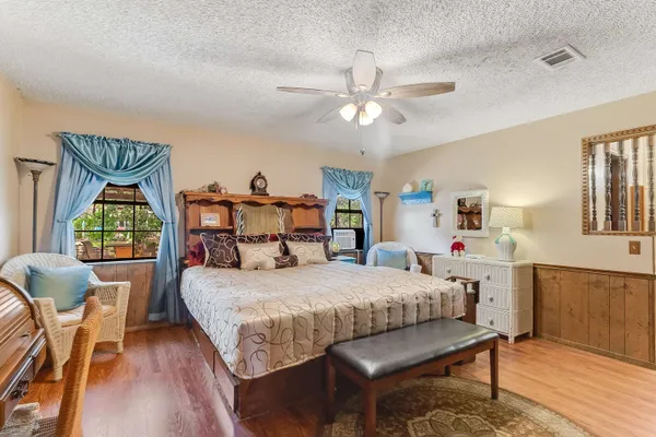 a bedroom with a bed and a table in it
