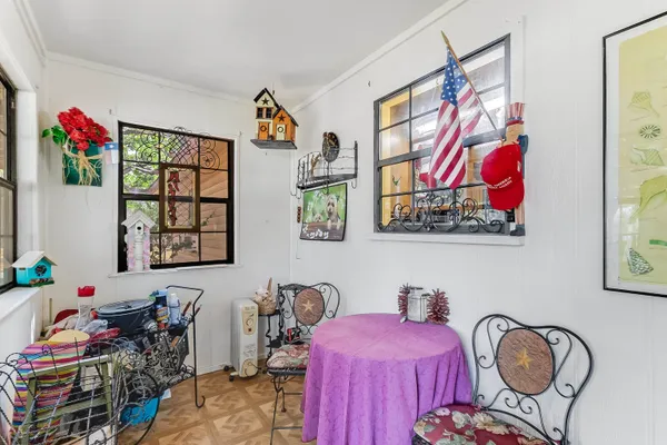 a bedroom with furniture and a window