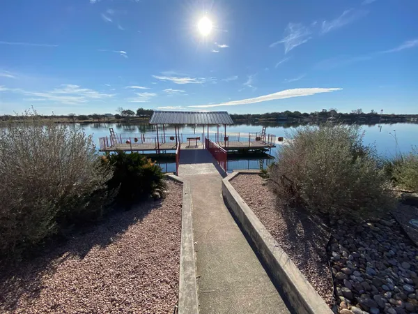 a picture of water with a building in the background