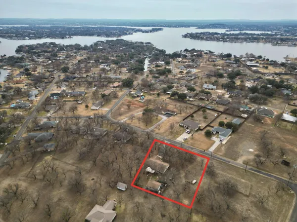 an aerial view of residential building and ocean
