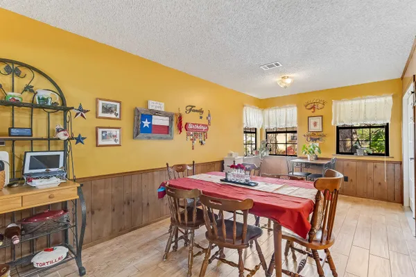 a dining room with furniture and window