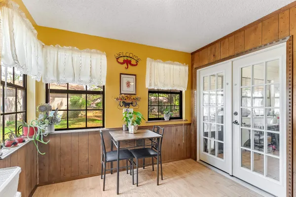 a view of a dining room with furniture and window