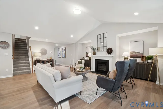 a large kitchen with granite countertop a sink and a refrigerator