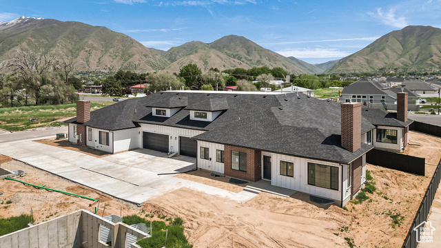 1631 West Century Lane, Unit B Mapleton, UT 84664 - Photo 32 of 33 View of front facade featuring a chimney, driveway, and roof with shingles