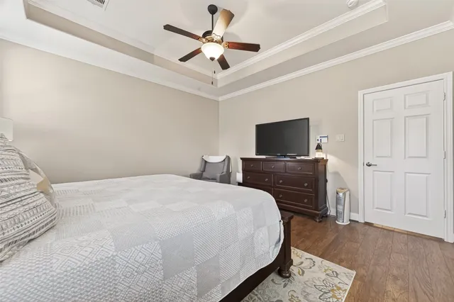 a spacious bathroom with a granite countertop sink a mirror a vanity and a shower