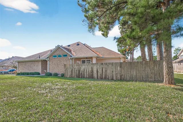 a view of a workspace with furniture and wooden floor