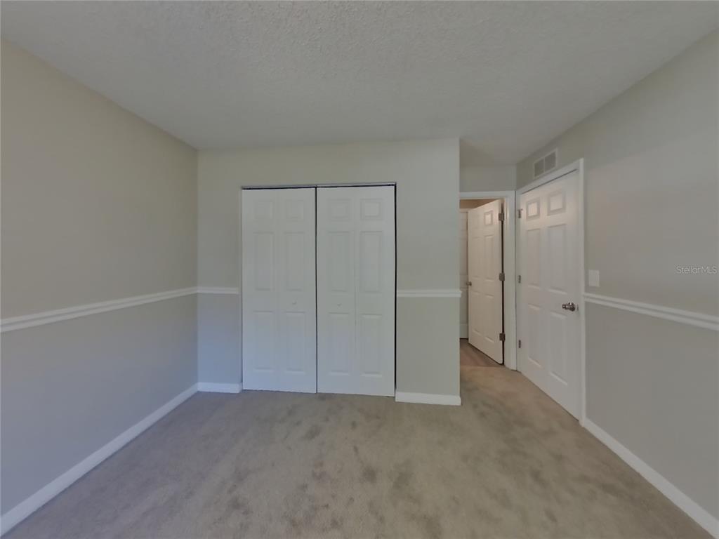 Undisclosed Address Spring Hill, FL 34606 - Photo 8 of 16 a view of an empty room