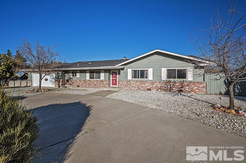 12005 Broken Hill Road Reno, NV 89511 - Photo 1 of 20 a front view of a house with a yard