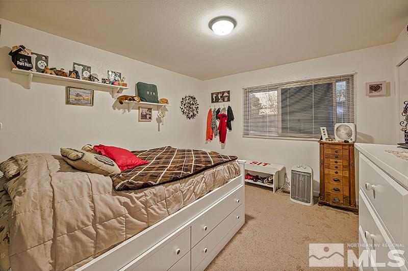 12005 Broken Hill Road Reno, NV 89511 - Photo 14 of 20 a bed room with a bed and furniture