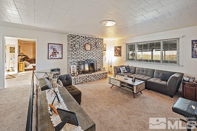 12005 Broken Hill Road Reno, NV 89511 - Photo 3 of 20 a living room with furniture and a fireplace