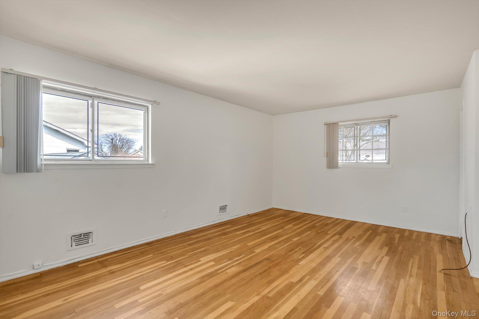 23 Madison Avenue Jericho, NY 11753 - Photo 23 of 29 Primary bedroom with hardwood floors
