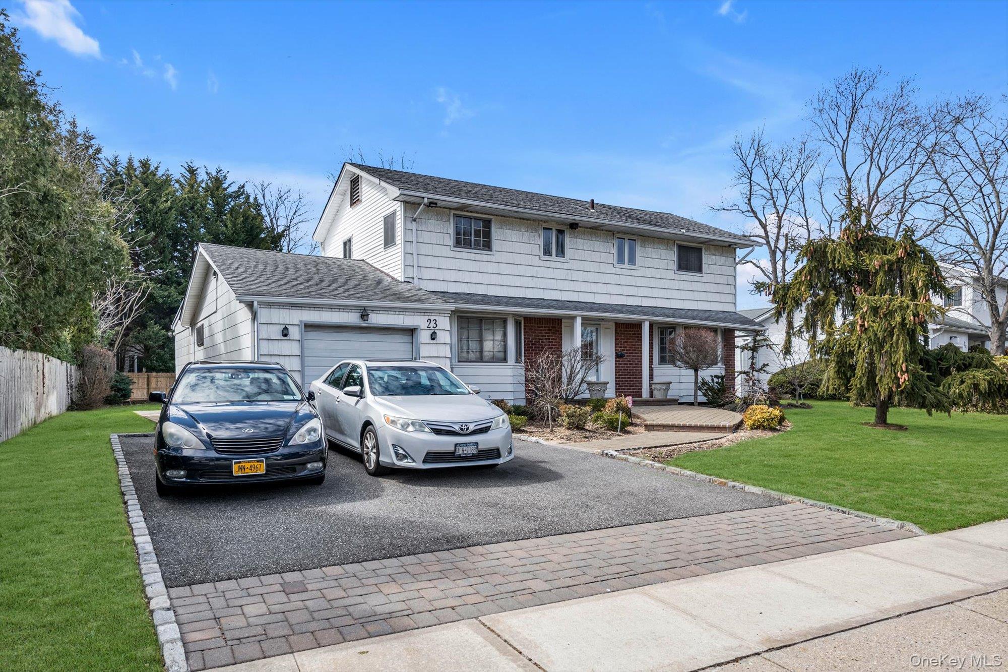 23 Madison Avenue Jericho, NY 11753 - Photo 29 of 29 Front of 4 bedroom expanded colonial with extended driveway and oversized yard