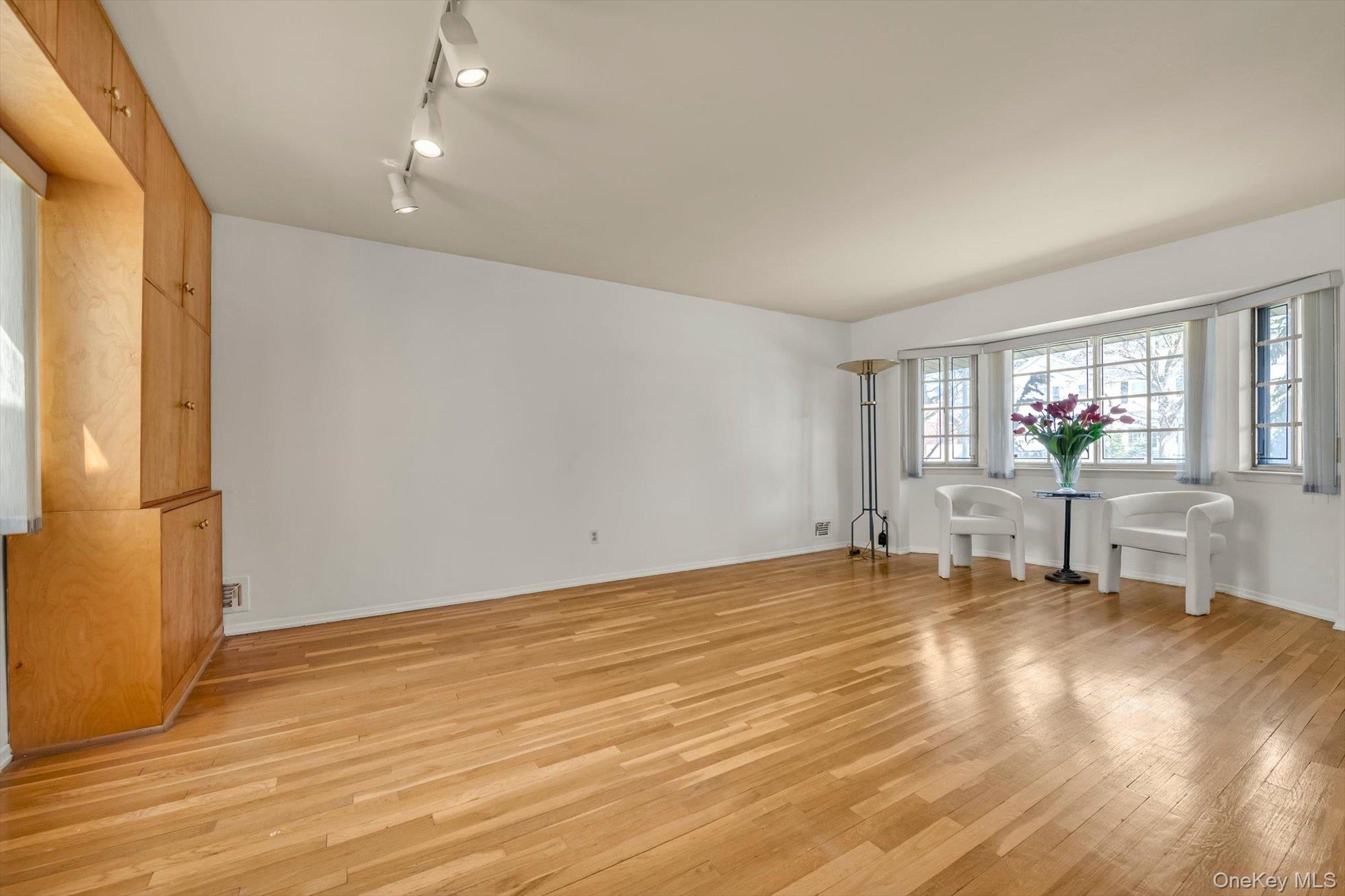 23 Madison Avenue Jericho, NY 11753 - Photo 7 of 29 Large living room with hardwood floors