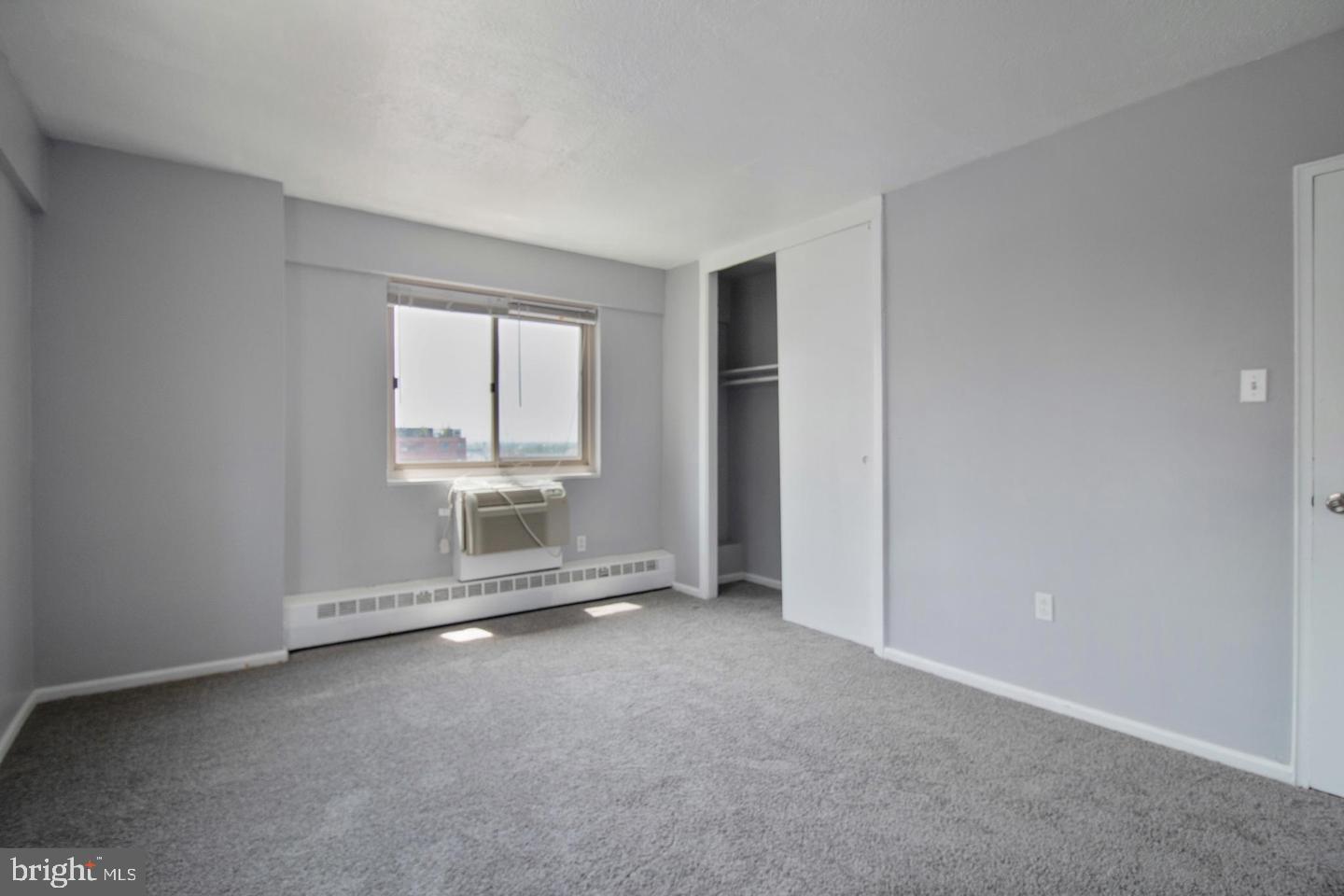 2101-17 Chestnut Street, Unit 1608 Philadelphia, PA 19103 - Photo 15 of 28 an empty room with windows