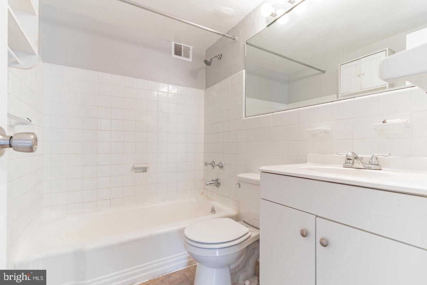 2101-17 Chestnut Street, Unit 1608 Philadelphia, PA 19103 - Photo 18 of 28 a bathroom with a sink a toilet and shower