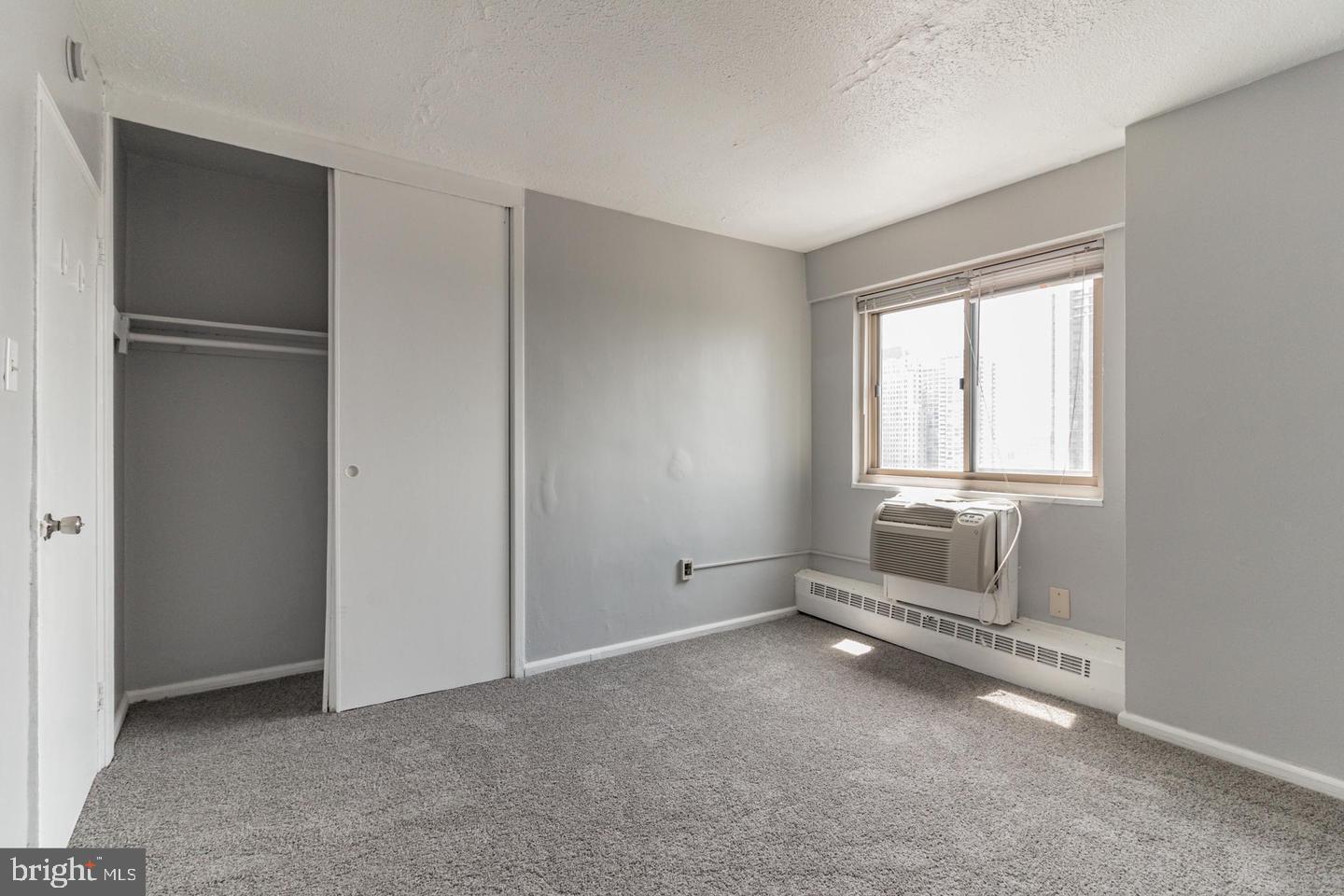 2101-17 Chestnut Street, Unit 1608 Philadelphia, PA 19103 - Photo 21 of 28 a room with windows and closet