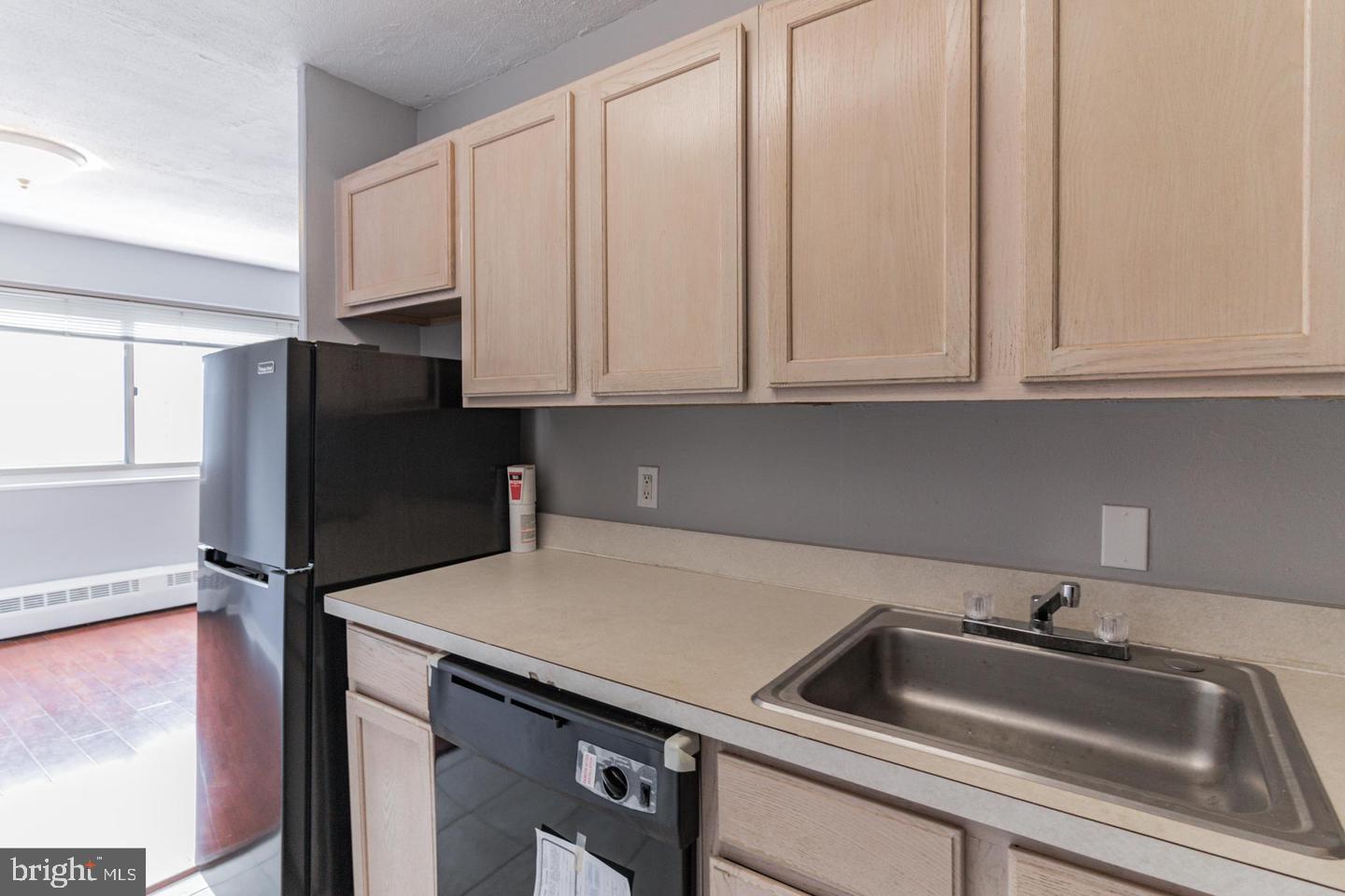 2101-17 Chestnut Street, Unit 1608 Philadelphia, PA 19103 - Photo 23 of 28 a kitchen with a sink and cabinets