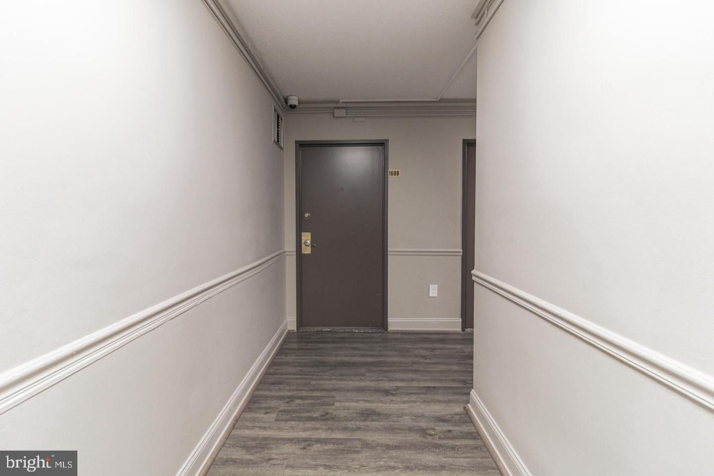 2101-17 Chestnut Street, Unit 1608 Philadelphia, PA 19103 - Photo 25 of 28 a view of a hallway with wooden floor