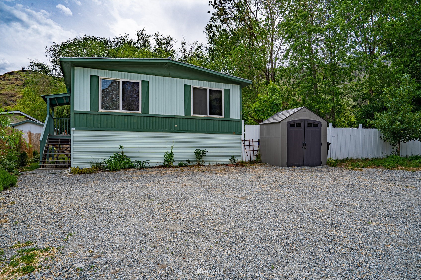 a house with trees in the background